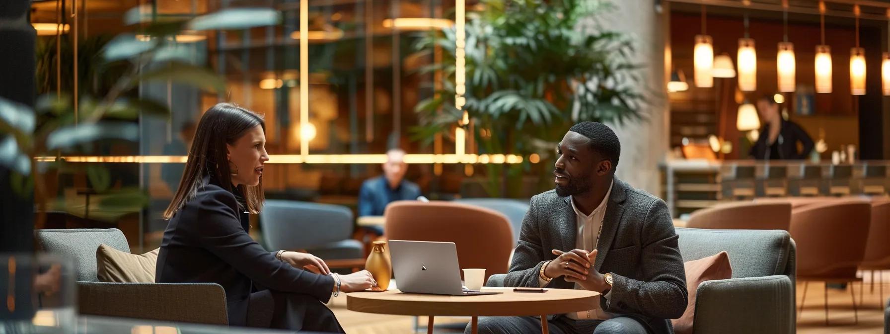 a warm, modern conference room setting showcases two professionals engaged in a deep conversation, their focused expressions reflecting empathy and active listening amidst a backdrop of sleek furniture and soft, ambient lighting.